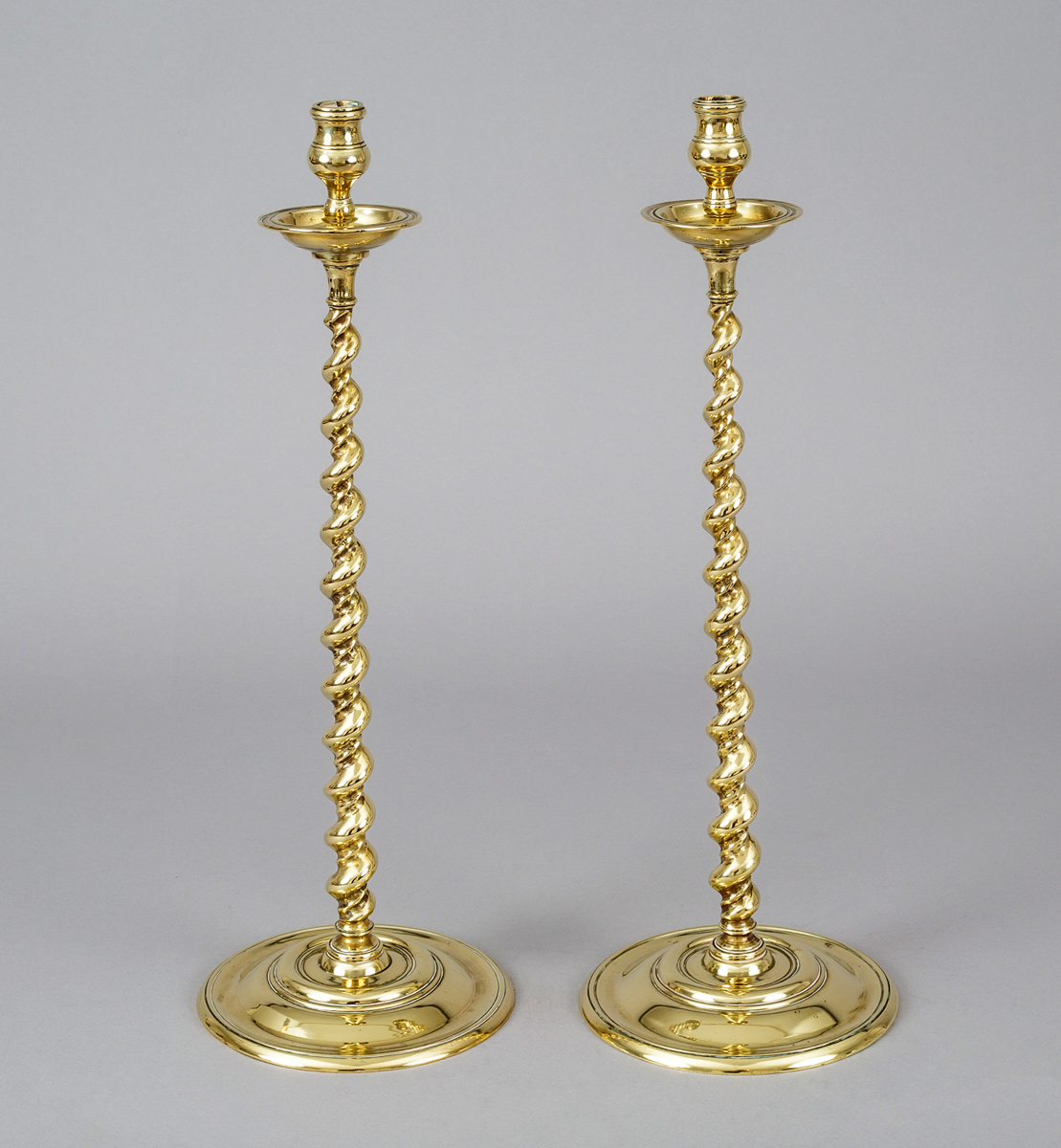 https://susansilverantiques.com/wp-content/uploads/antique-pair-brass-tall-twist-candlesticks-circa-1880-susan-silver-antiques-5918.jpg